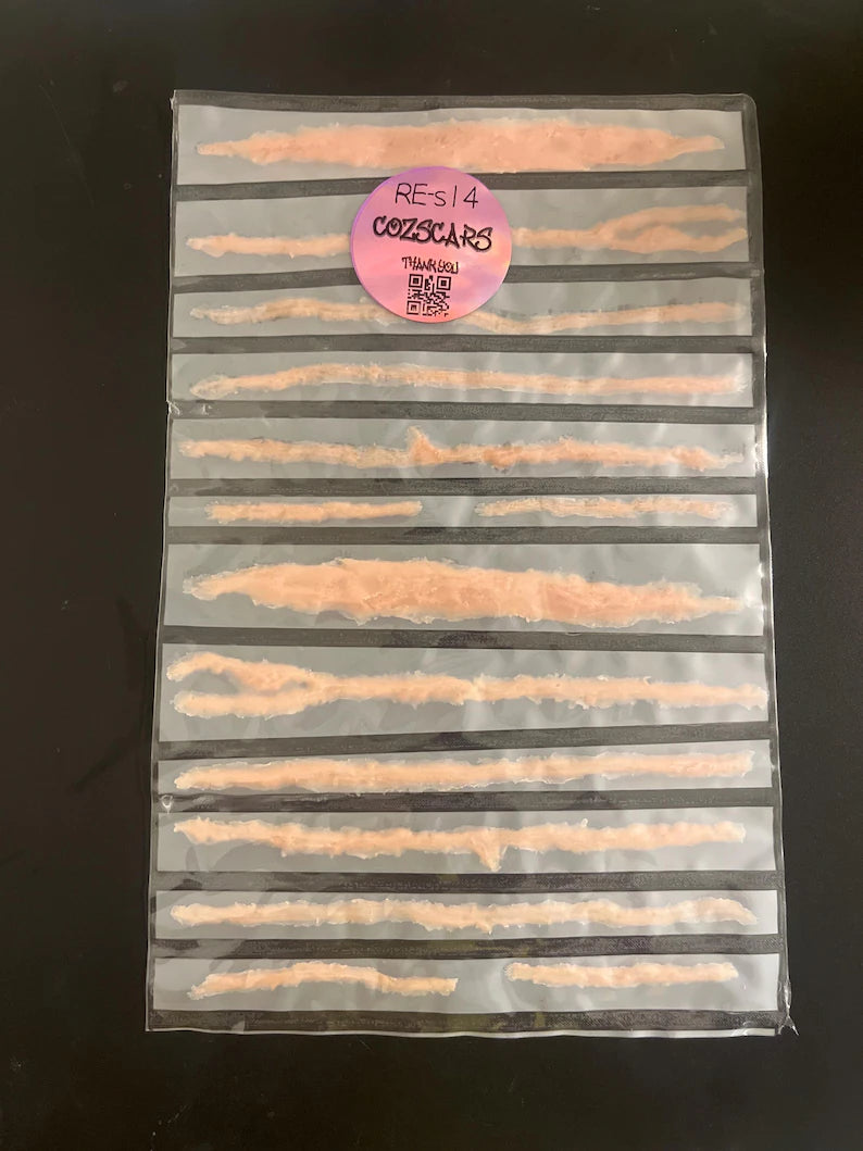 3D lifelike raised slash scars for creating a more realistic cosplay experience. Easy to apply. 14 prosthetic healed battle wounds.