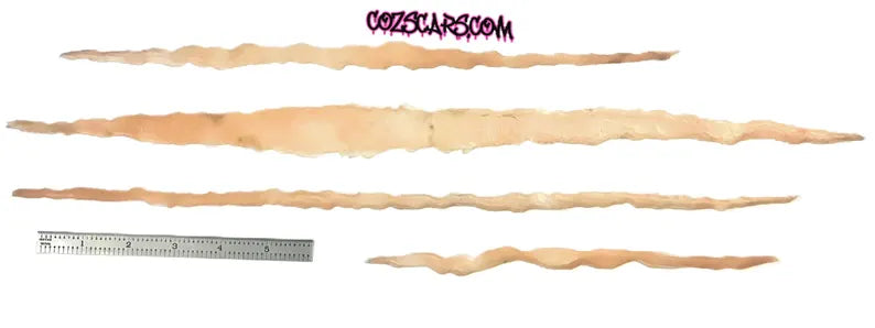 Chest length 18-8” XL realistic body slash scars for helping creat your best cosplay. Easy to apply, reuse. Raised 3D, healed battle wounds!
