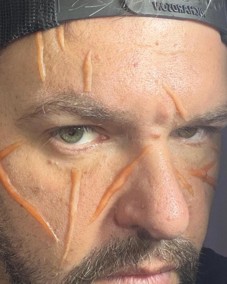 Large random cosplay body slash scars for adding to your best cosplay experience. Easy to apply. Raised 3D, healed battle wounds!